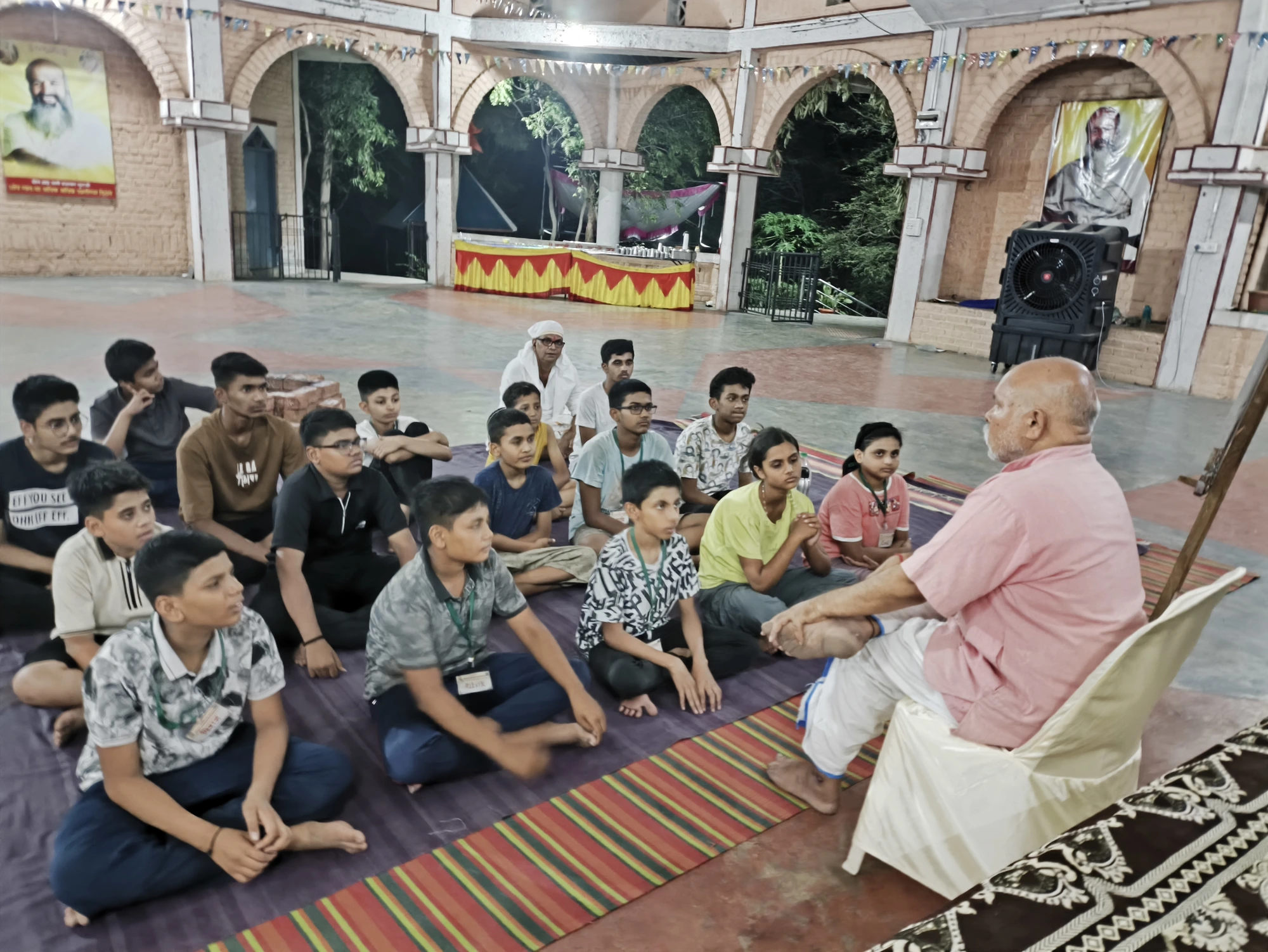 Guruji signing blessings for children at night session